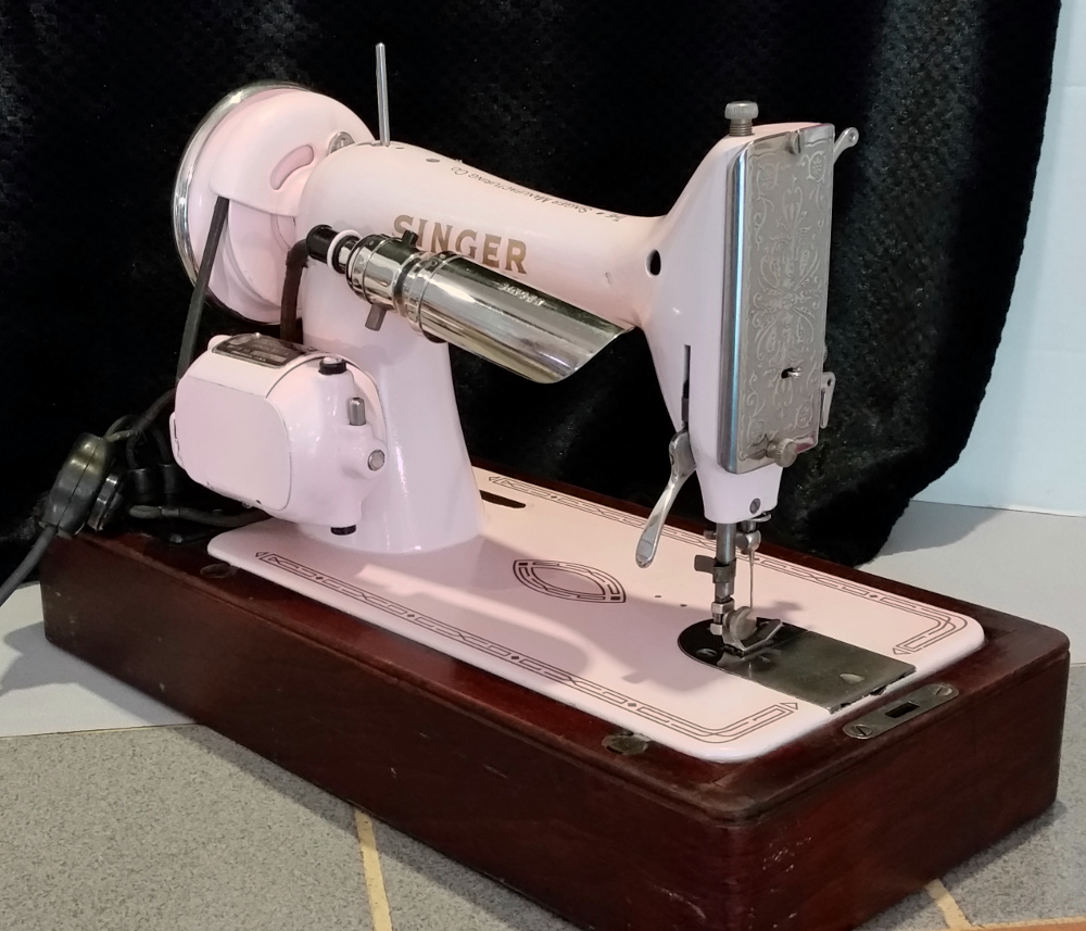 Beautiful pink Singer model 99 vintage sewing machine in bentwood case